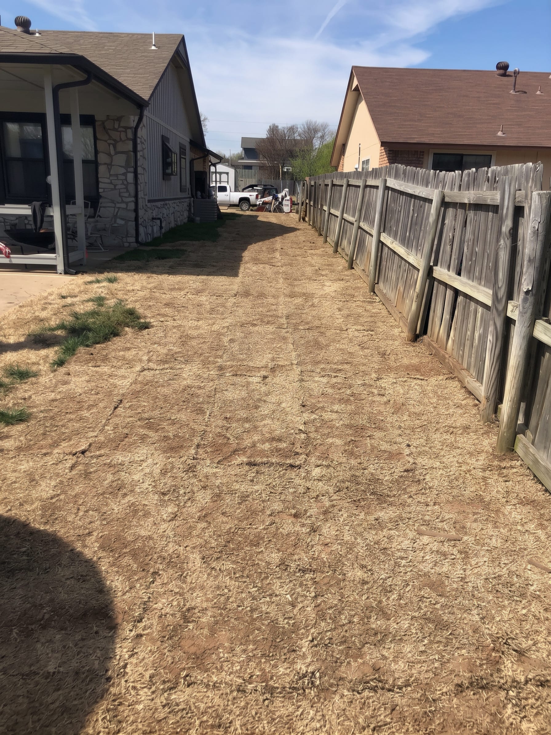 A freshly graded side yard