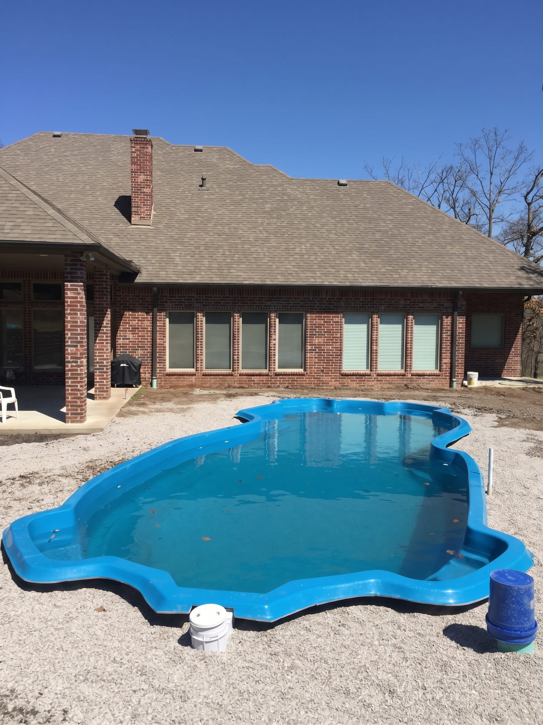 A fiberglass pool set in the finished dig