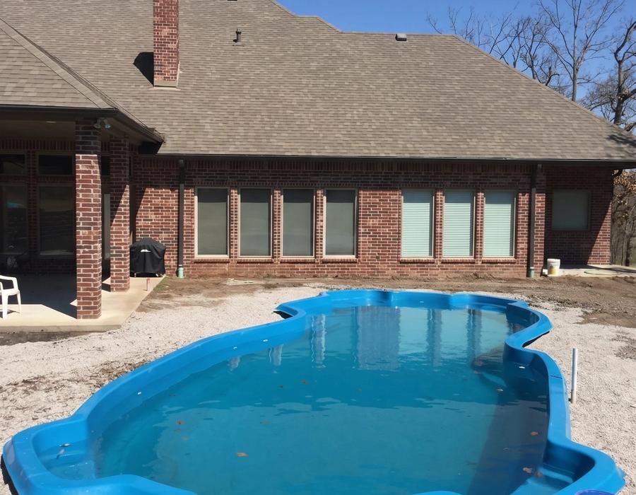 A fiberglass pool set in the finished dig