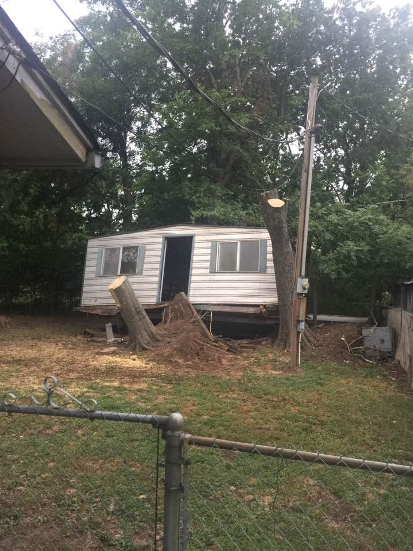 A mobile home being cleared off a lot