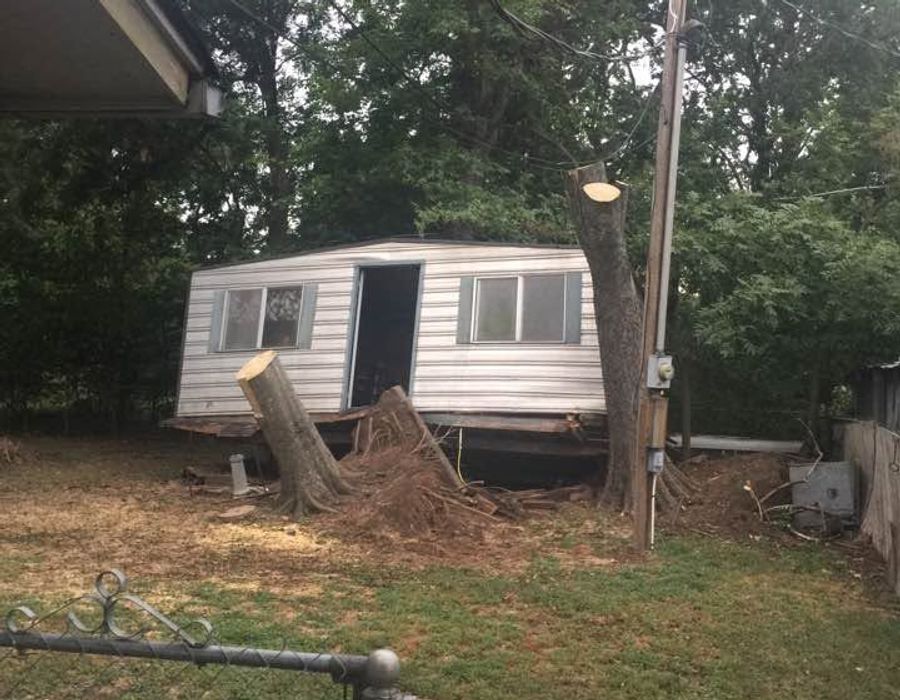 A mobile home being cleared off a lot