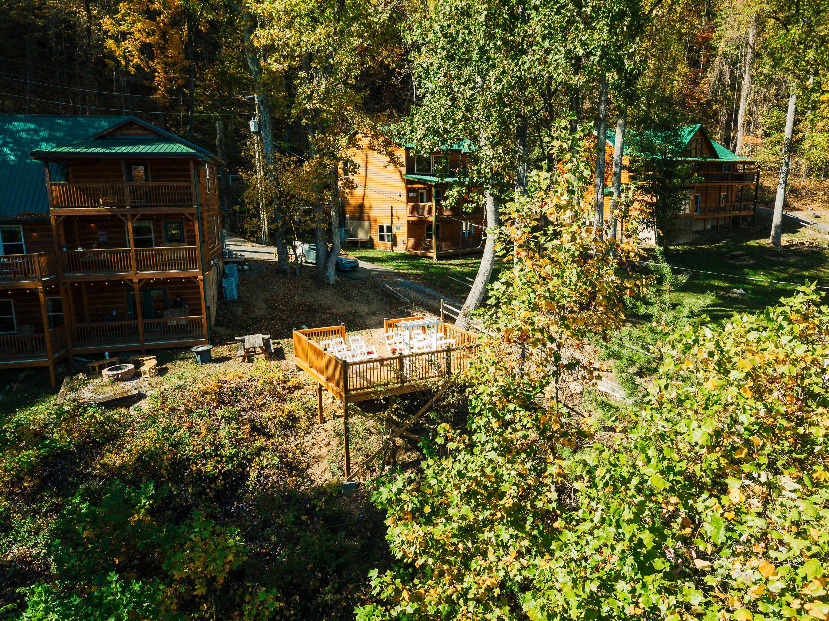 Far away shot of a GE venue deck with trees and lodging sites in the background.
