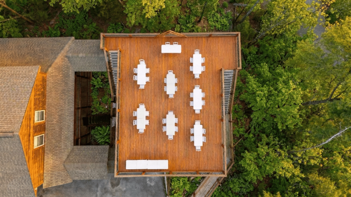 Drone aerial photo of Elegant Elite Estate surrounded by mountain forest
