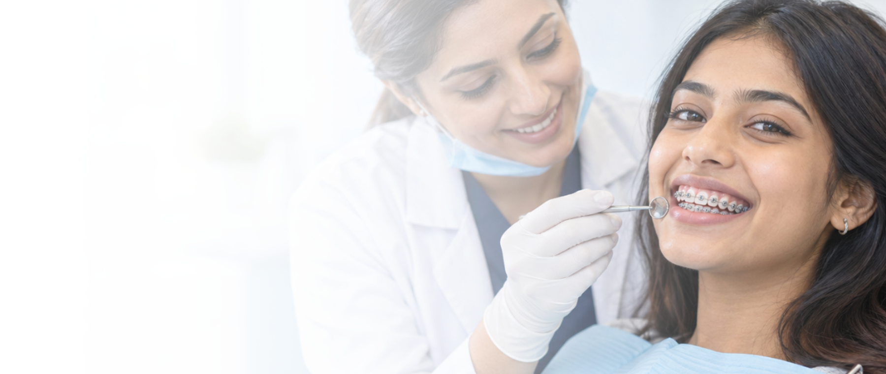 Teeth braces in Islamabad: young woman with metal braces smiling during a dental check-up