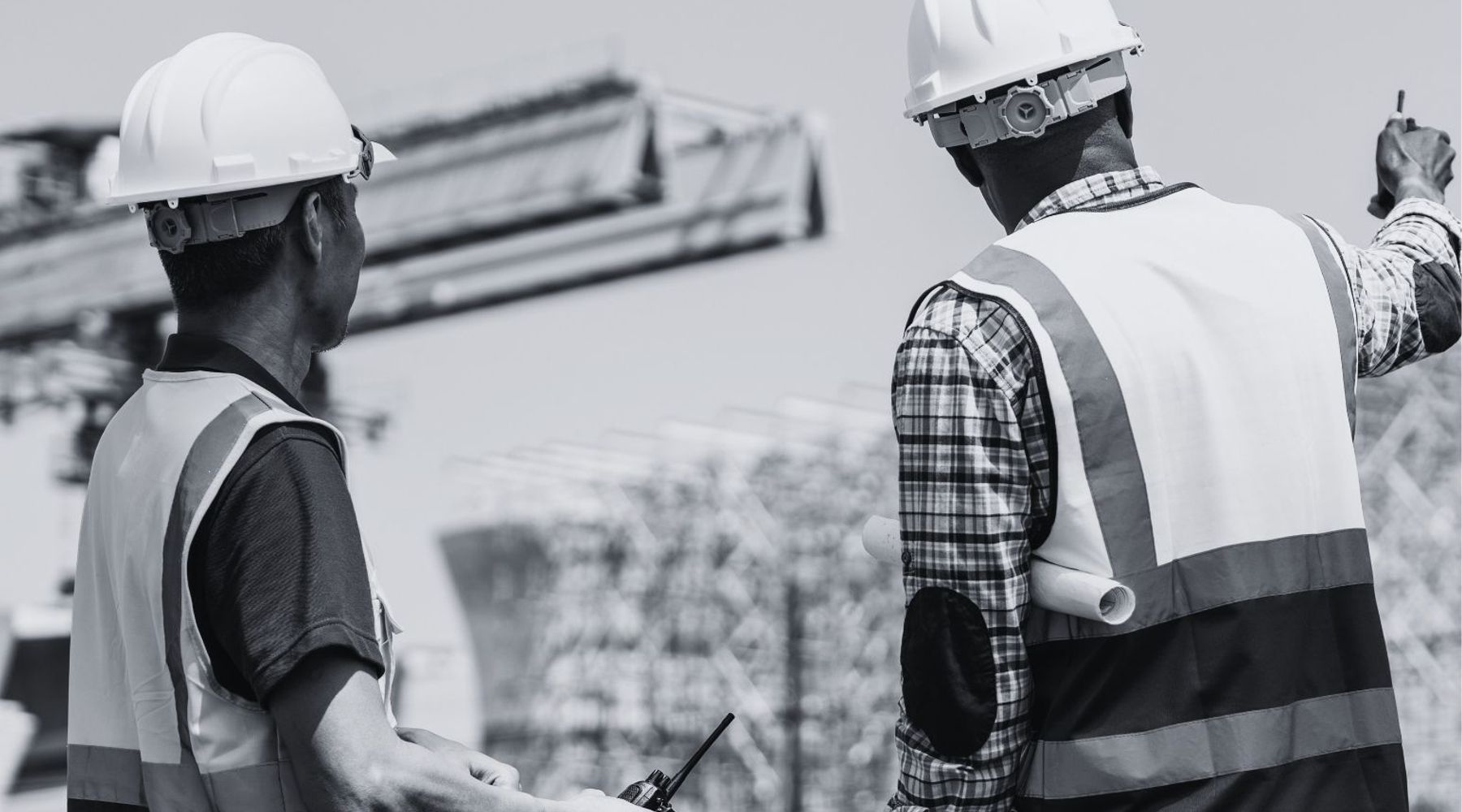 Picture of two men working at an industrial and infrastructure services site