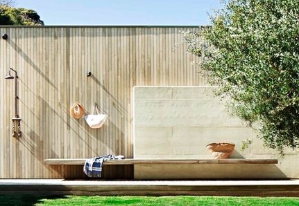 Outdoor shower with wooden battens and bench seat in Melbourne