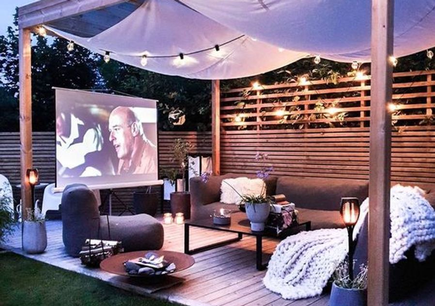 Garden patio cinema with lounges