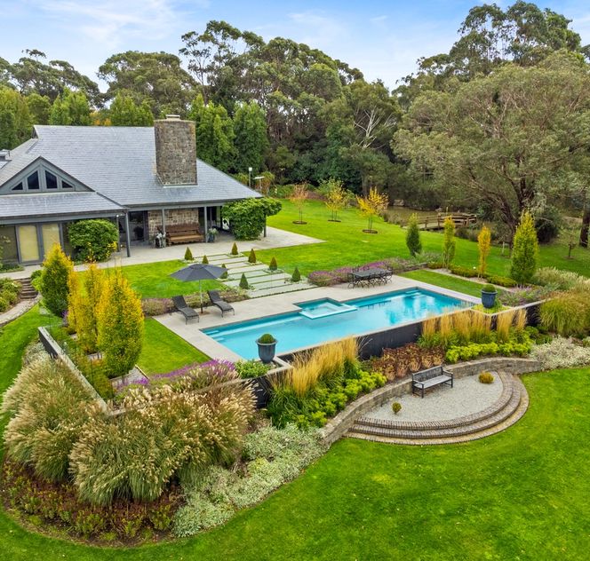 Aerial shot of luxury Macedon Ranges home's pool and landscaping by Mint