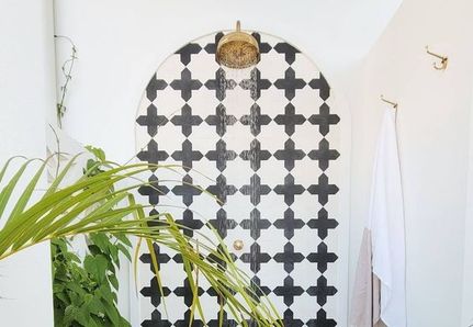 Outdoor shower black and white tile pattern