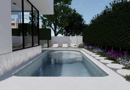 Curved pool design with luxury sun loungers in a resort-style garden