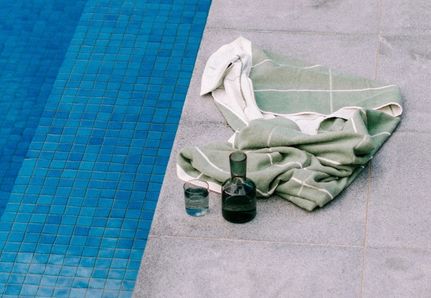 Pool pavers poolside with Baina towel from Simple Form
