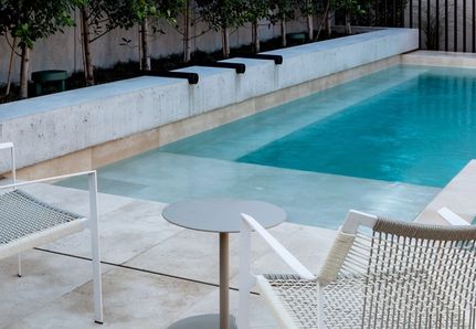 Looking at the pool and water spouts with Cosh Living outdoor furniture at Williamstown Beach House project by Mint Design