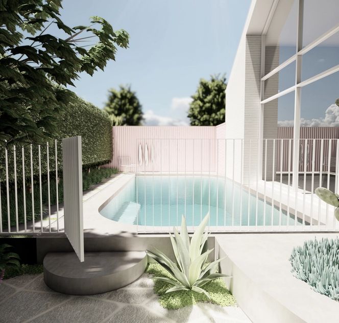 Pool area with curved pool and pink fence by Mint Pool and Landscape for Norsu home