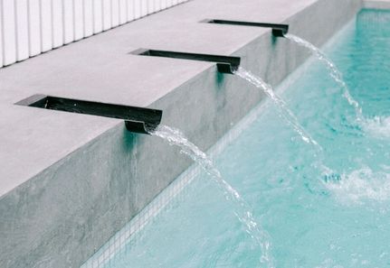 Steel powder coated water spouts in pool for real dads of Melbourne Holiday Home