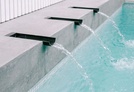 Steel powder coated water spouts in pool for real dads of Melbourne Holiday Home