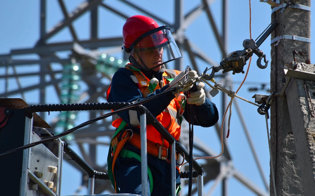 Linesman working on a utility pole