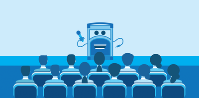Referral Rock character talking on stage to a group of people