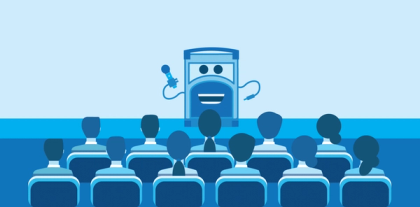 Referral Rock character talking on stage to a group of people