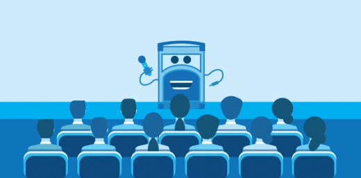 Referral Rock character talking on stage to a group of people