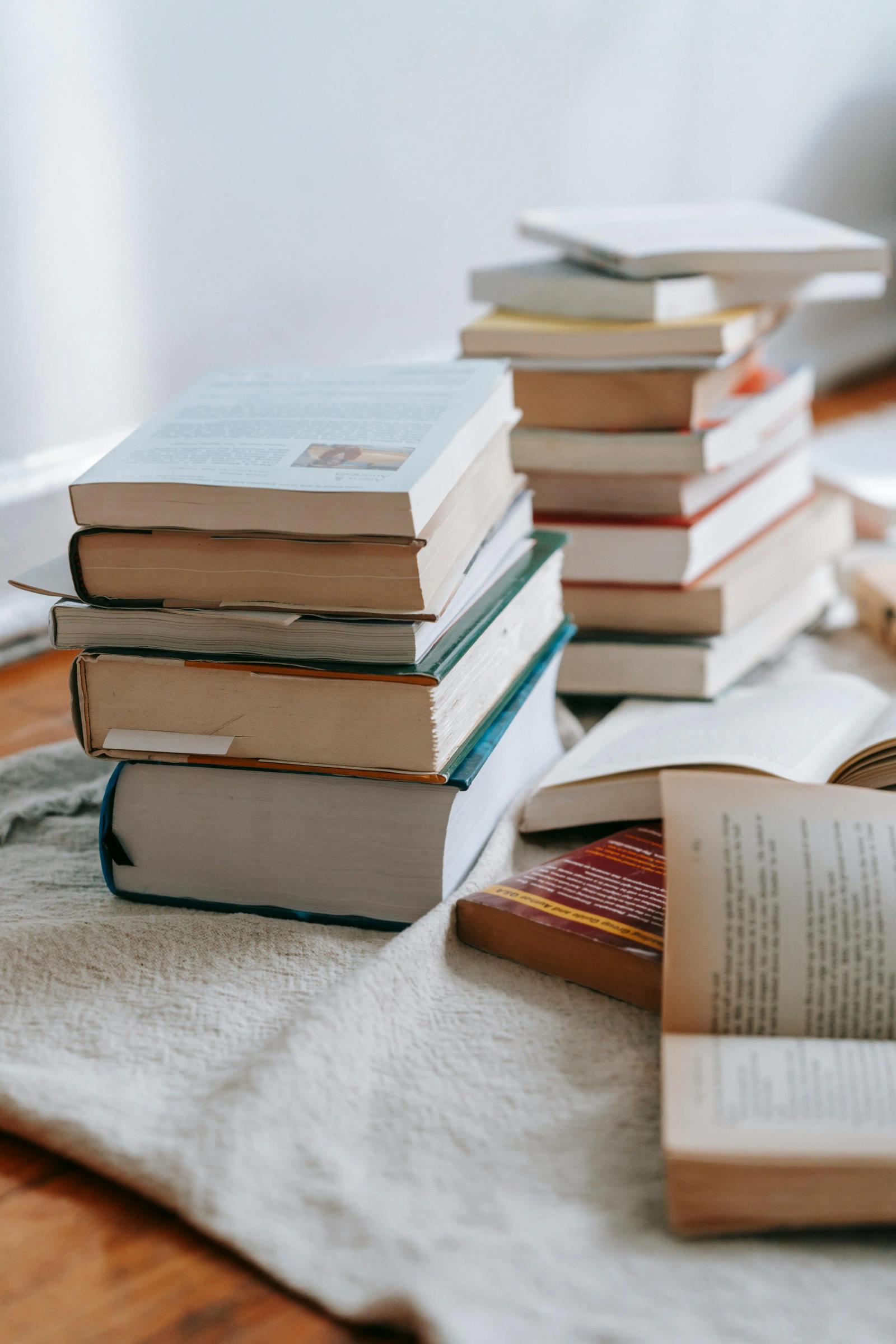 A stack of books on systems thinking and strategic planning