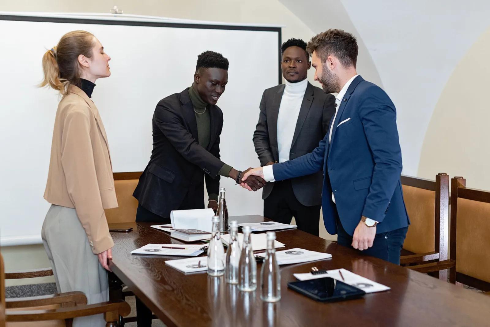 Sealing an agreement across the boardroom table