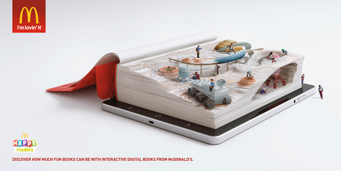 A McDonald's advertisement featuring a giant book with interactive digital books on its pages, with people and objects from various McDonald's menu items, such as a Big Mac, fries, and a McFlurry, on the pages.
