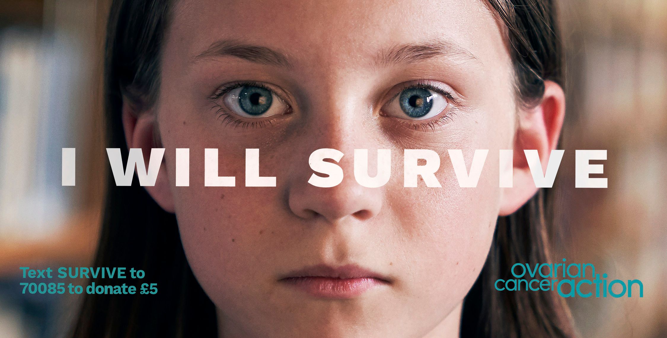 A close-up of a woman's face with a serious expression, with a text overlay reading 'I WILL SURVIVE' in large white letters.