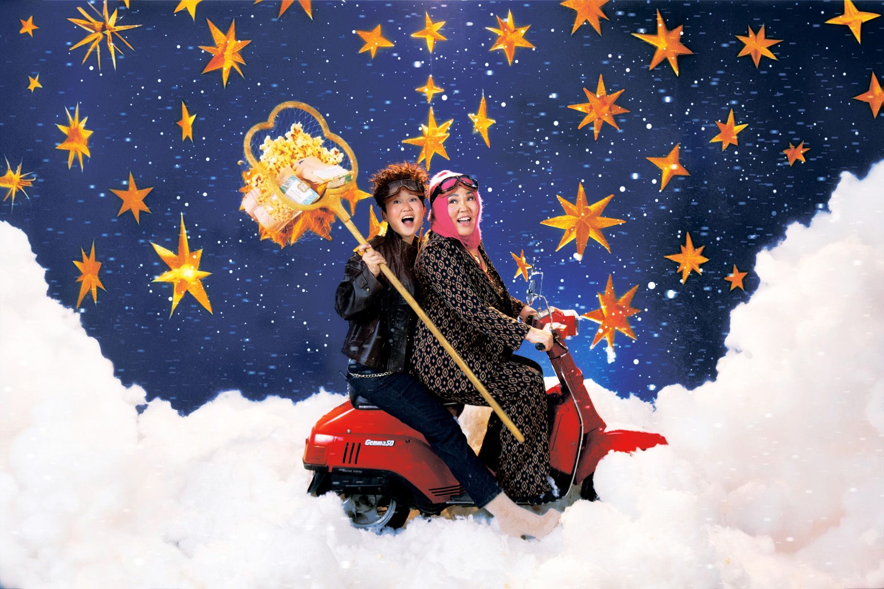 A man in a black leather jacket and jeans and a woman in a black and white patterned dress and pink scarf ride a red scooter through a snowy landscape under a starry night sky.