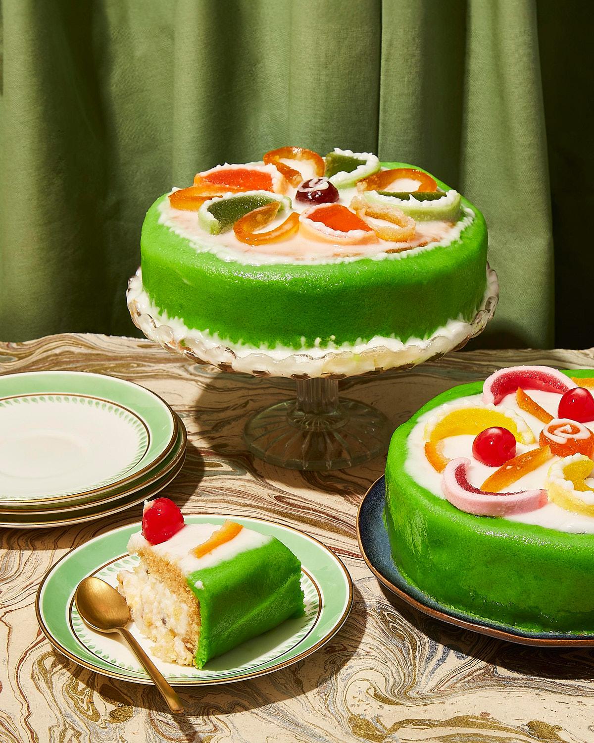 A vibrant, colorful image of a layered green and cream dessert.