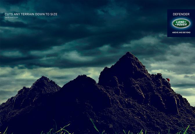A large pile of dark, damp, and dirty soil or mud, possibly from a construction site or a natural disaster