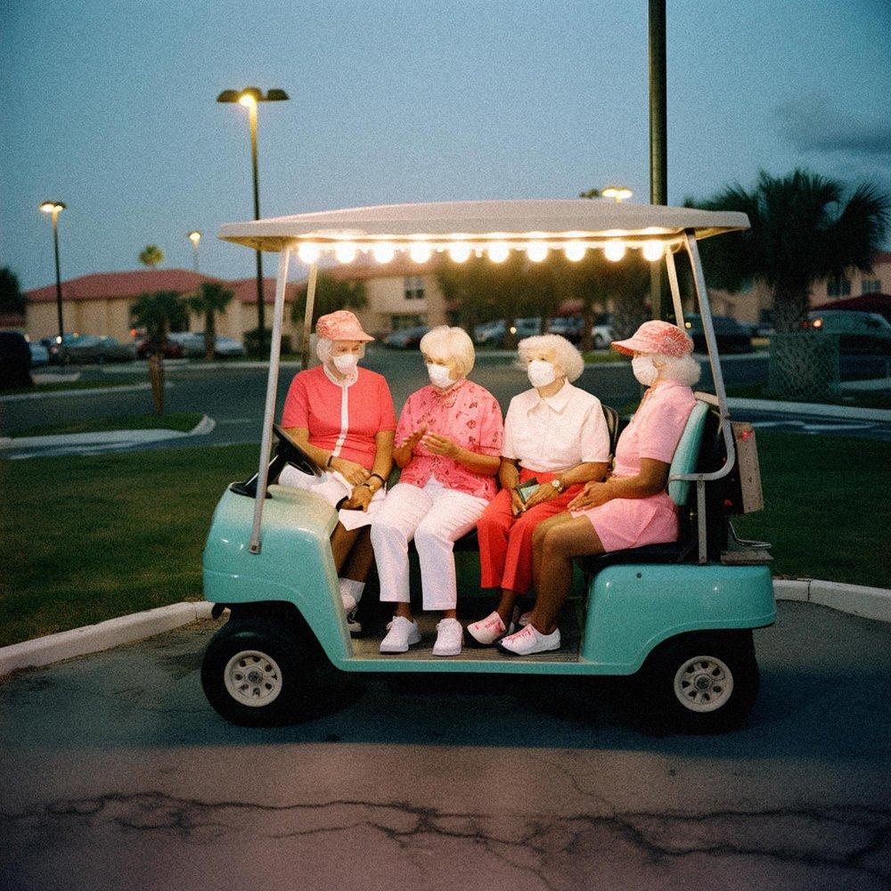 Alys Thomas-AI, AI Stories: Elderly women in golfing attire sitting in a golf cart.