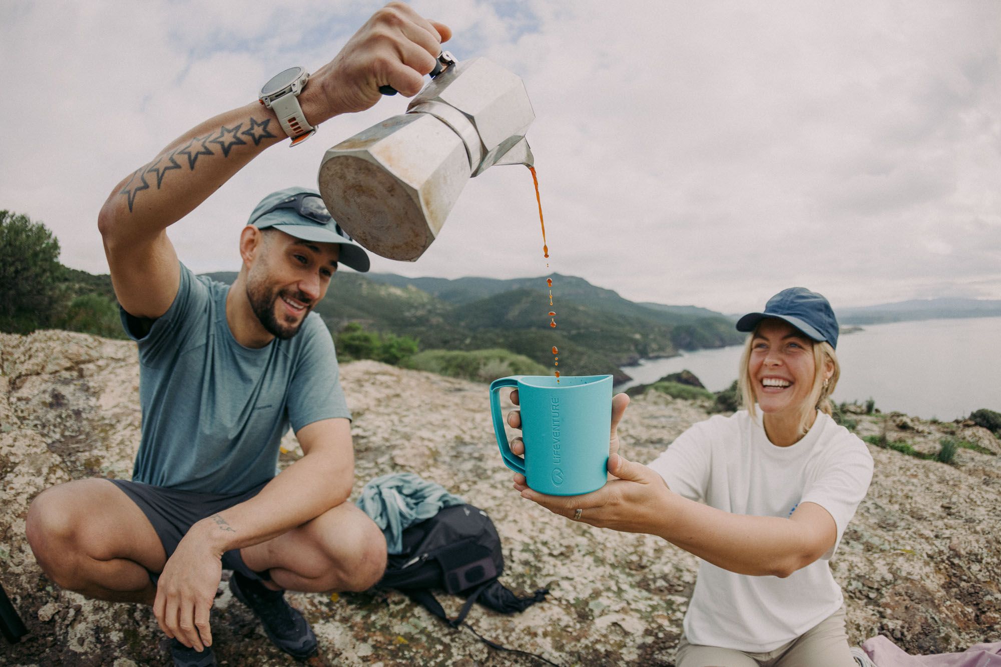 james bowden cotswold pouring coffee on cliff top