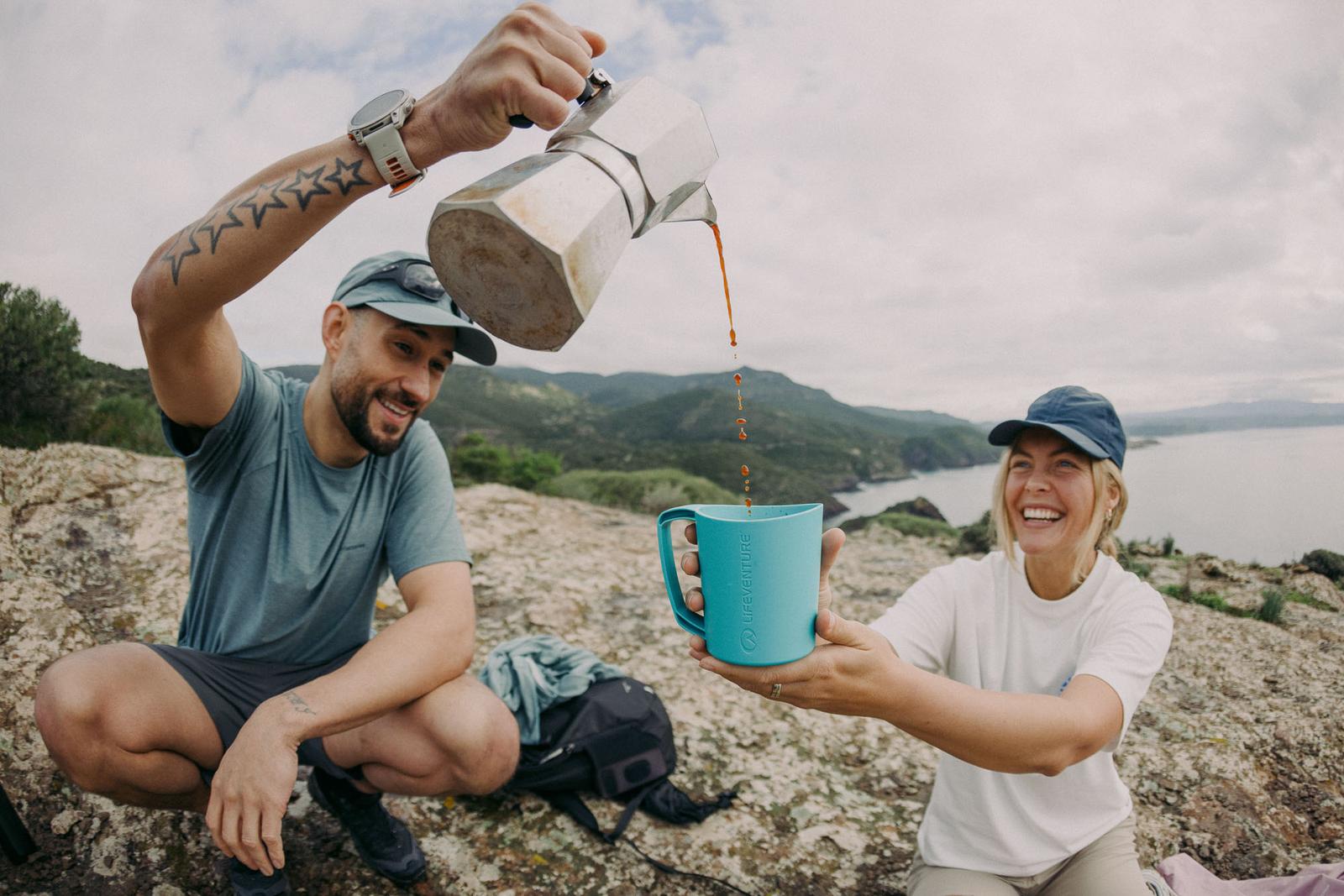 james bowden cotswold pouring coffee on cliff top