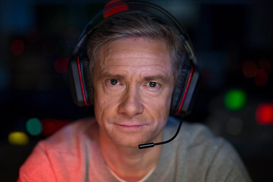 A man wearing a headset and looking directly at the camera with a serious expression, likely in a recording or broadcasting environment.