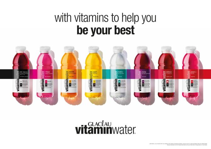 A collection of bottles of various flavors of Vitamin Water, a popular beverage brand.