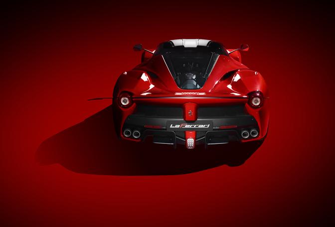 A red Ferrari sports car is the main subject of the image.