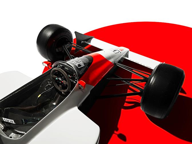 A Formula 1 racing car, specifically the McLaren Senna, is the main subject in the image.
