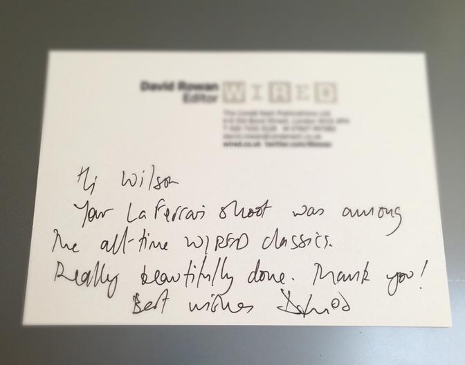 A handwritten note on a white piece of paper, with a few lines of text in a cursive handwriting style.