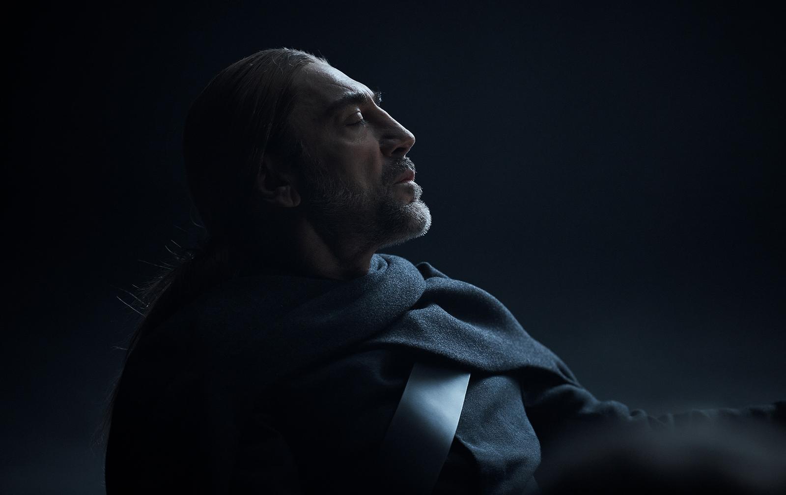 Javier Bardem looks up and to the right with a serious expression in an Uber Eats-themed artwork.