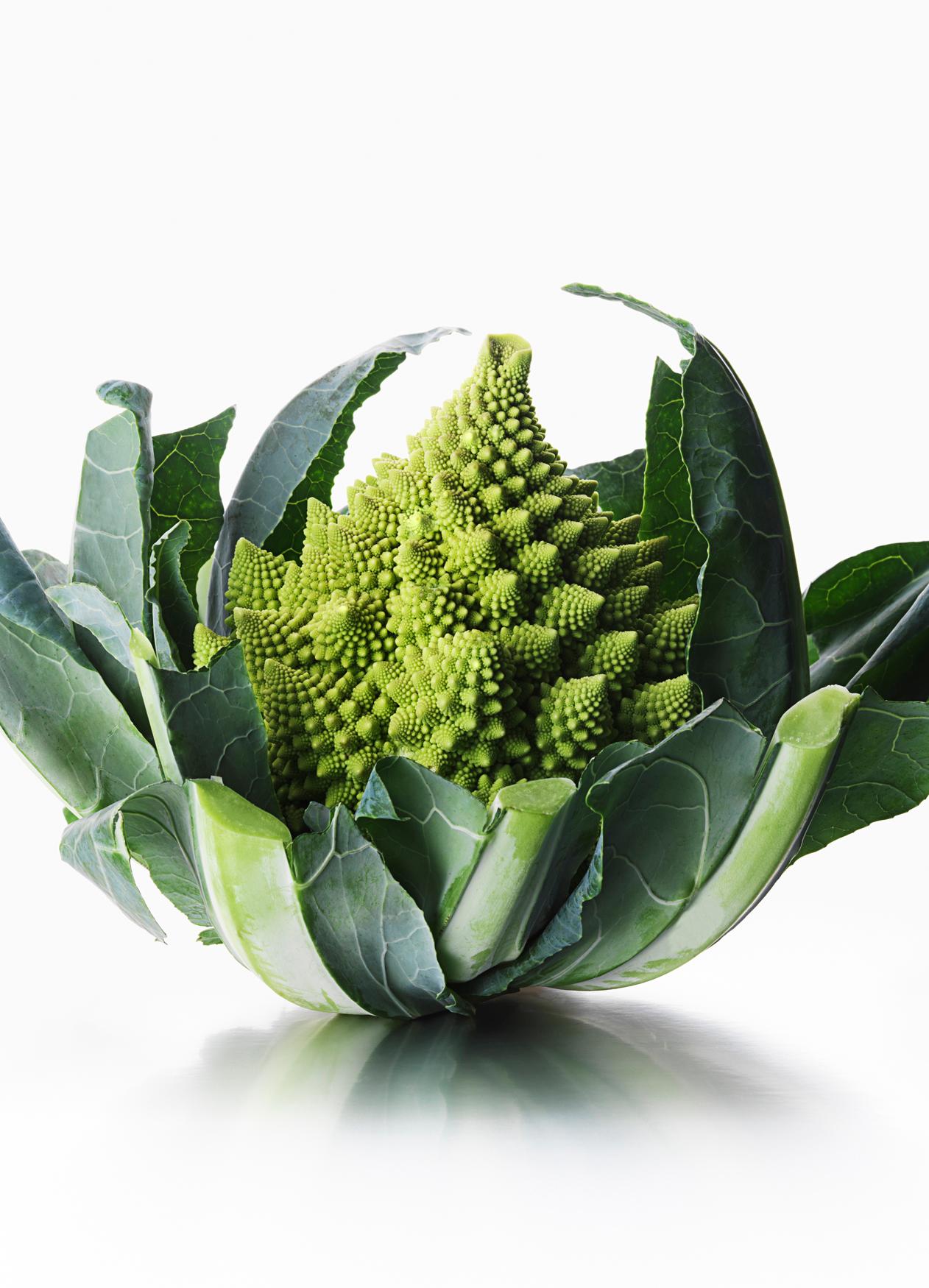 A close-up of a Romanesco broccoli head, with its distinctive, intricate, and symmetrical florets.