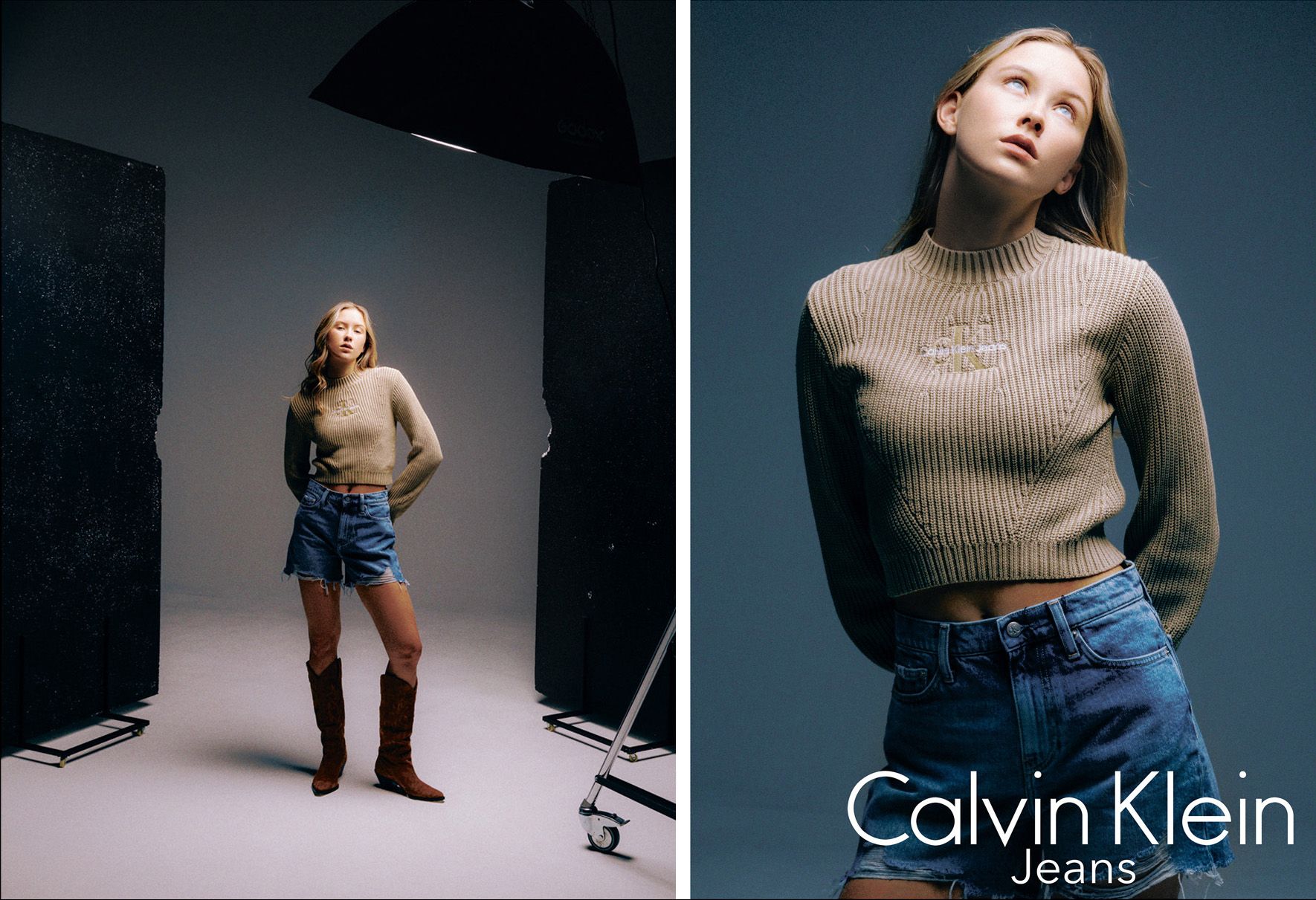 Darina Umka wearing a beige sweater, denim shorts, and brown boots, posing in a studio with a dark background.