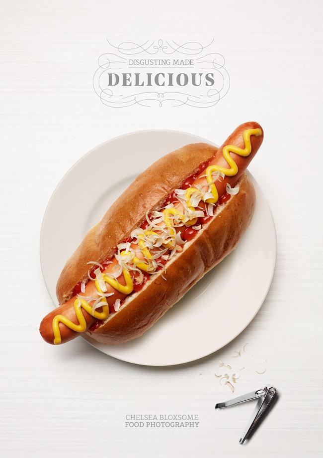A deliciously made hot dog with a variety of toppings, including a juicy sausage, crispy bacon, and a sprinkle of cheese, all served on a toasted bun.
