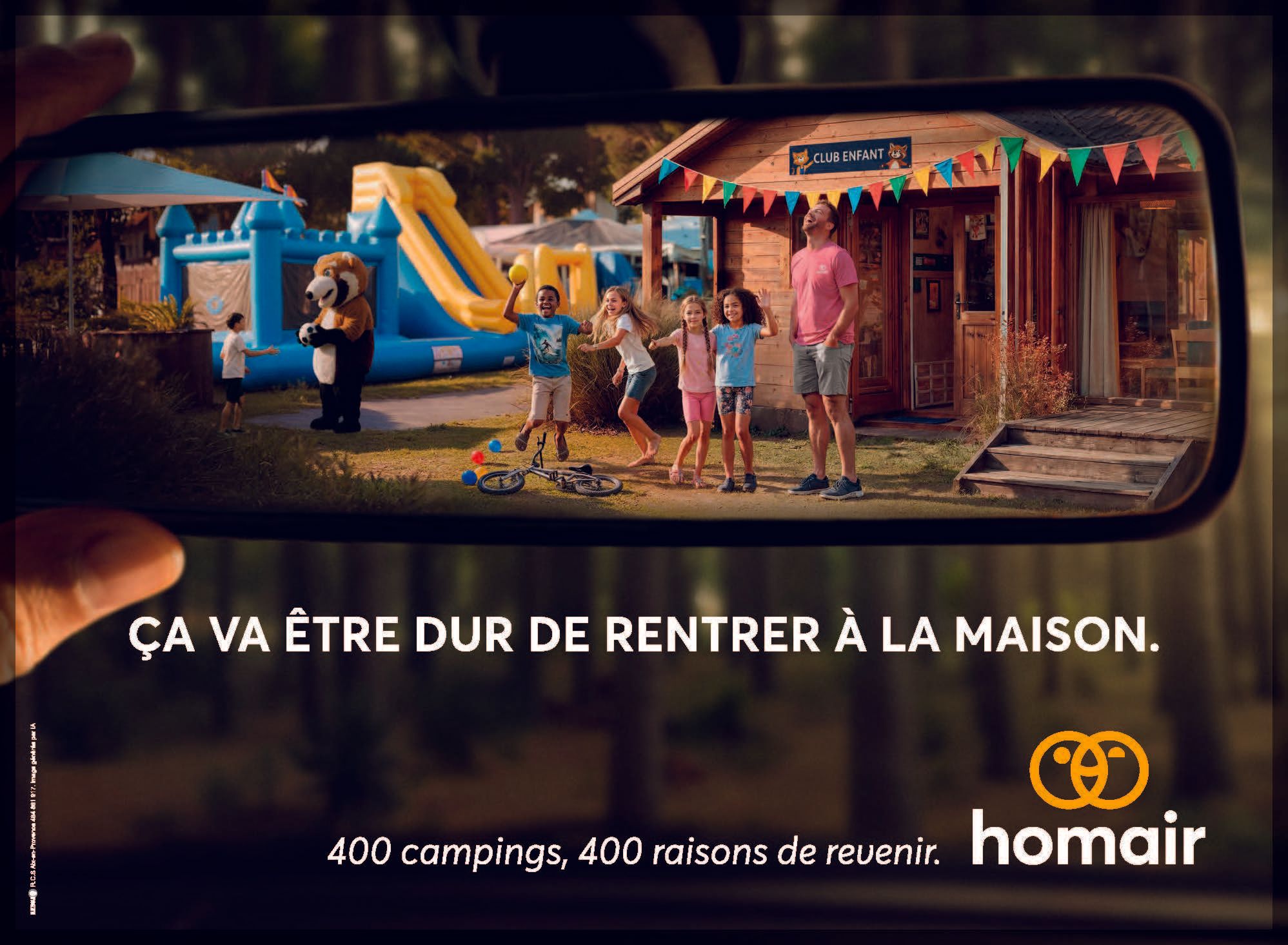 Alys Thomas Camping Homair 3 looking at family camping scene through car mirror bouncy castle