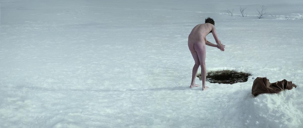 Julian Wolkenstein beechams man about to jump into icy water hole in snow naked