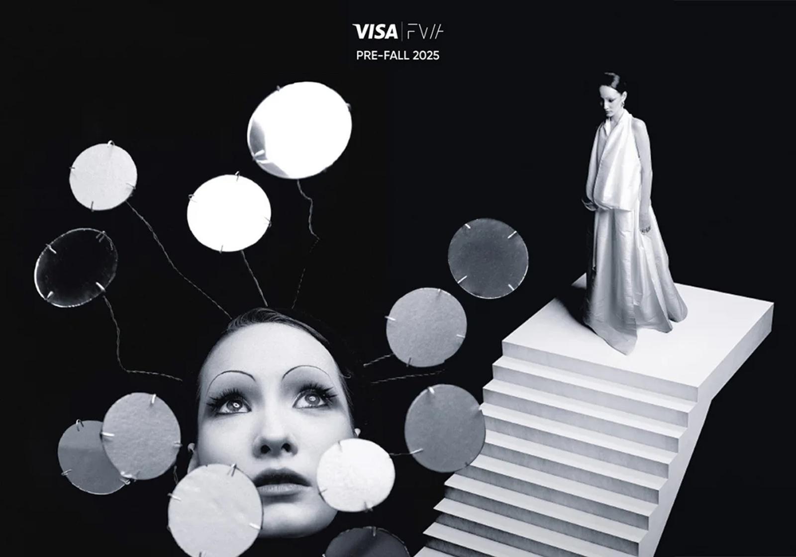 A woman in a white, floor-length, flowing gown stands on a white, geometric, stepped platform, surrounded by floating, white, circular, paper-like objects.