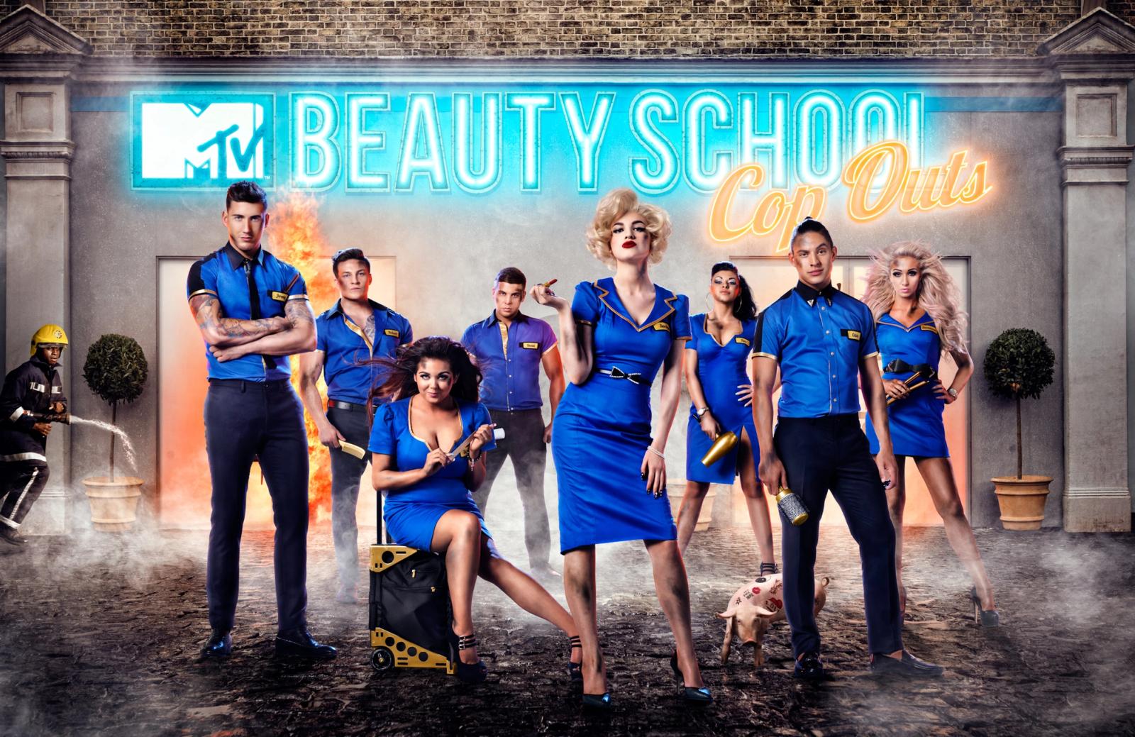 A group of people in blue uniforms standing in front of a building with an MTV Beauty School sign.