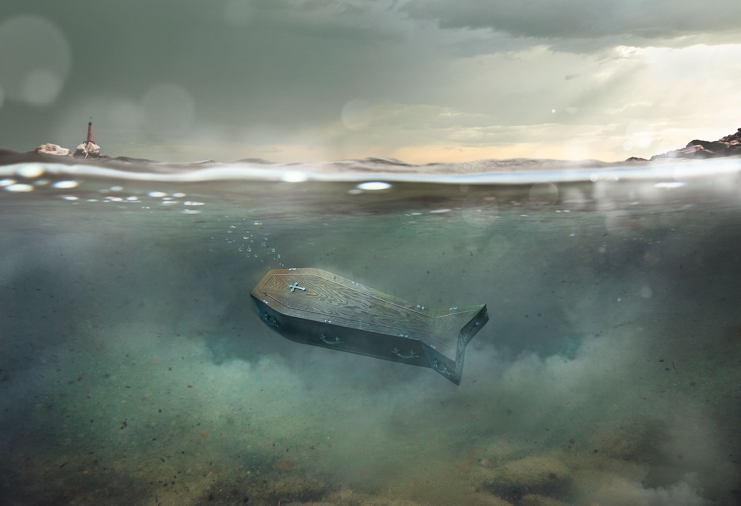 A wooden coffin submerged in water with a lighthouse visible in the background.