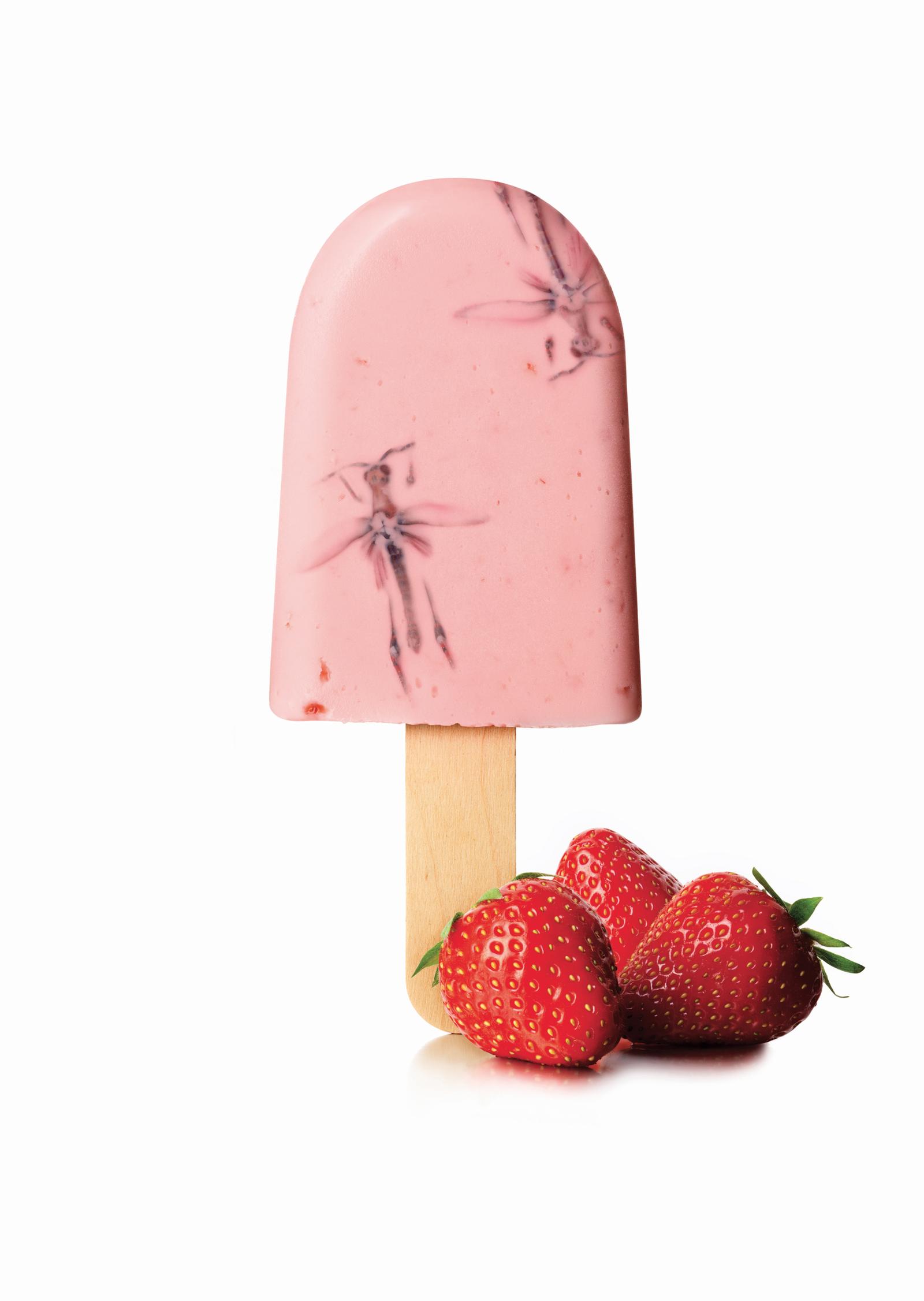 A pink ice cream on a stick with a strawberry-flavored ice cream and a strawberry on top, surrounded by three fresh strawberries.