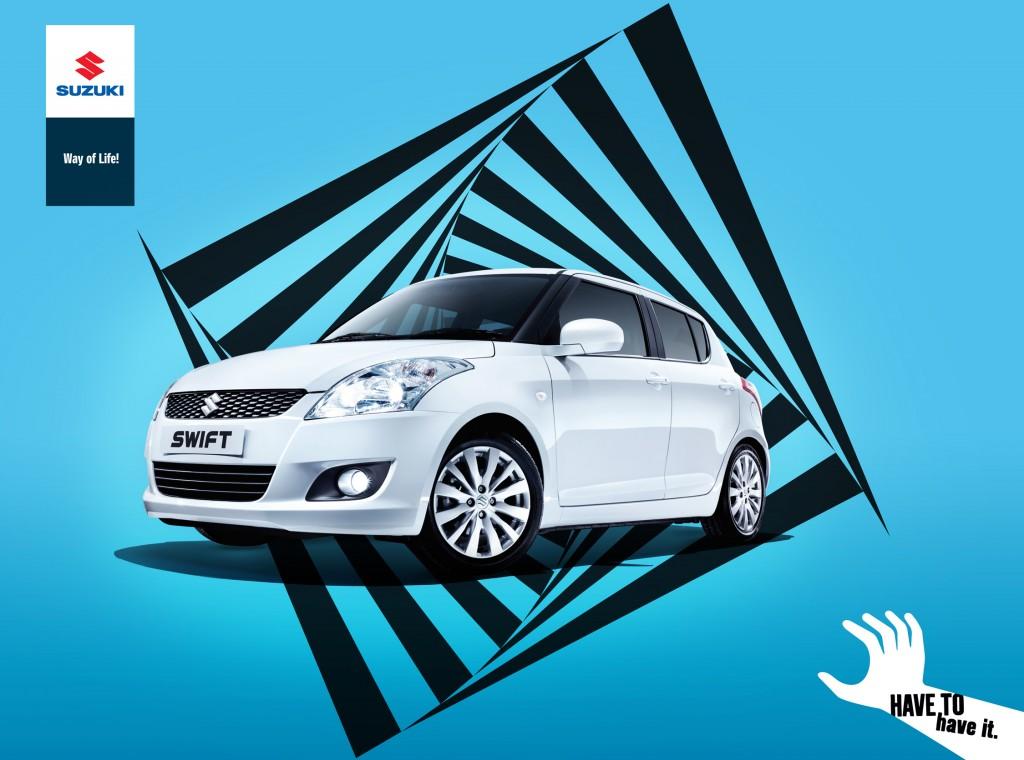 A white Suzuki Swift car is featured in the image.
