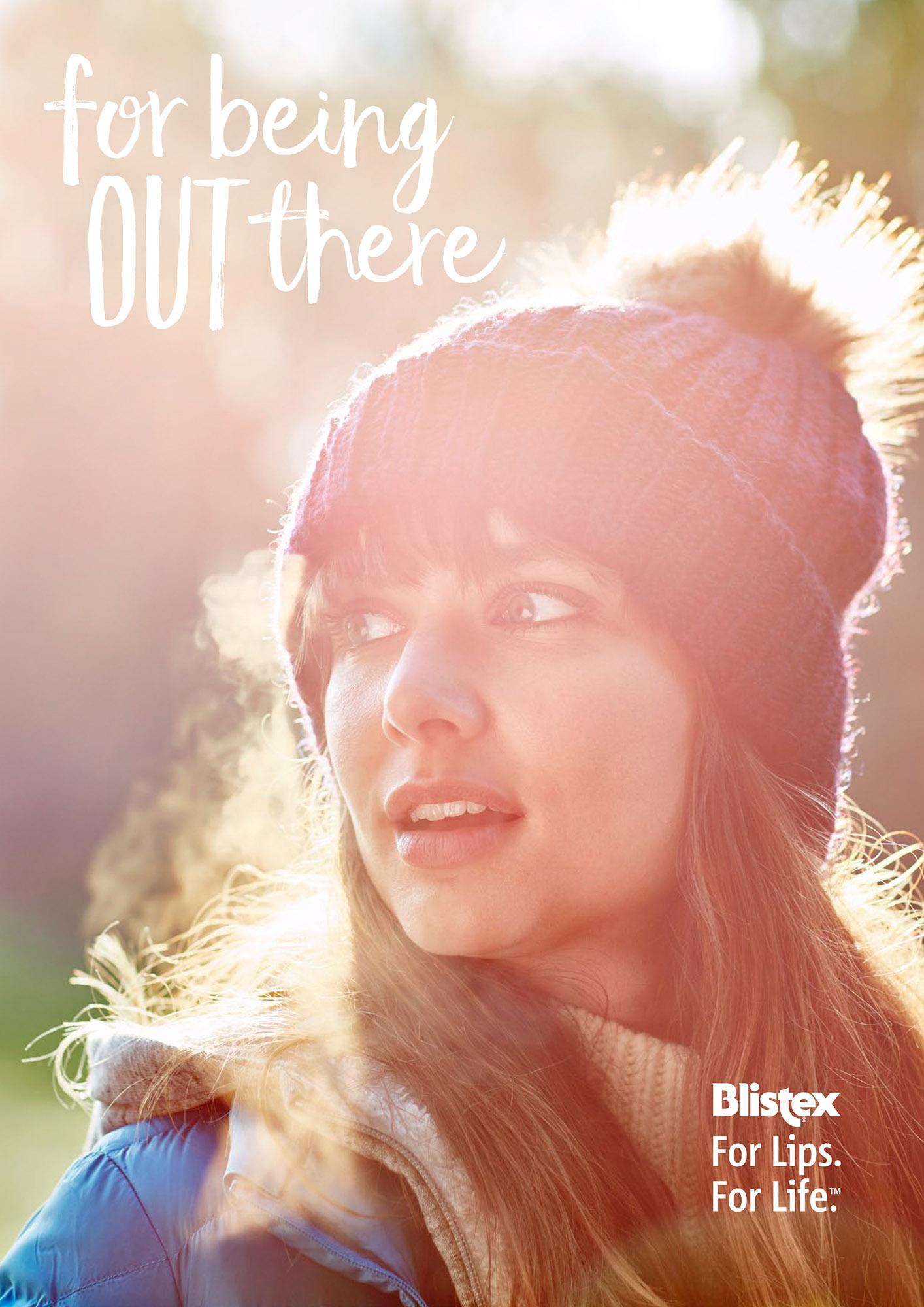 A woman in a winter hat and coat, with a Blistex logo in the corner.